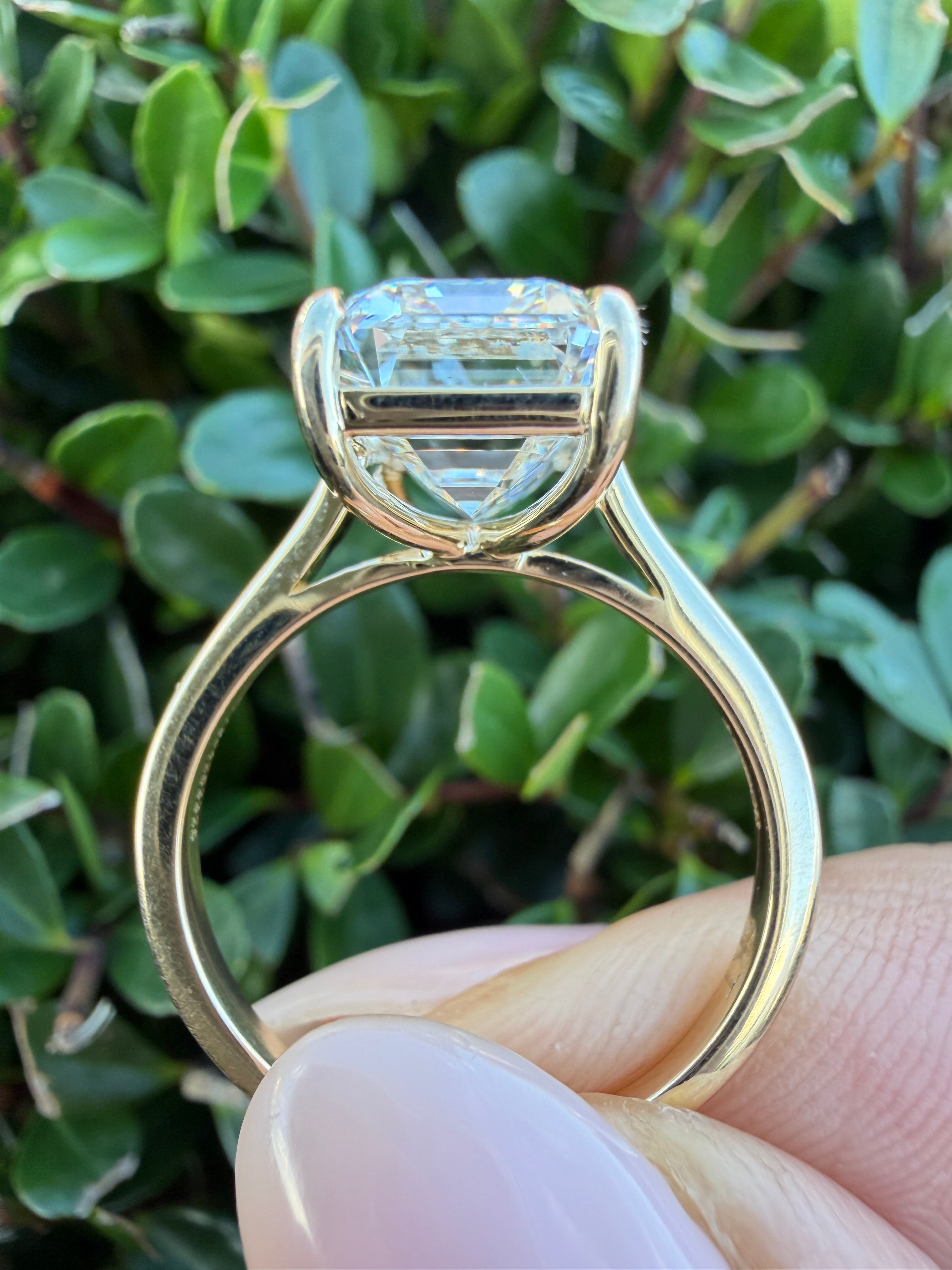 5.03ct emerald cut Lab Grown Diamond Solitaire Ring IGI Certified set in 9k yellow gold