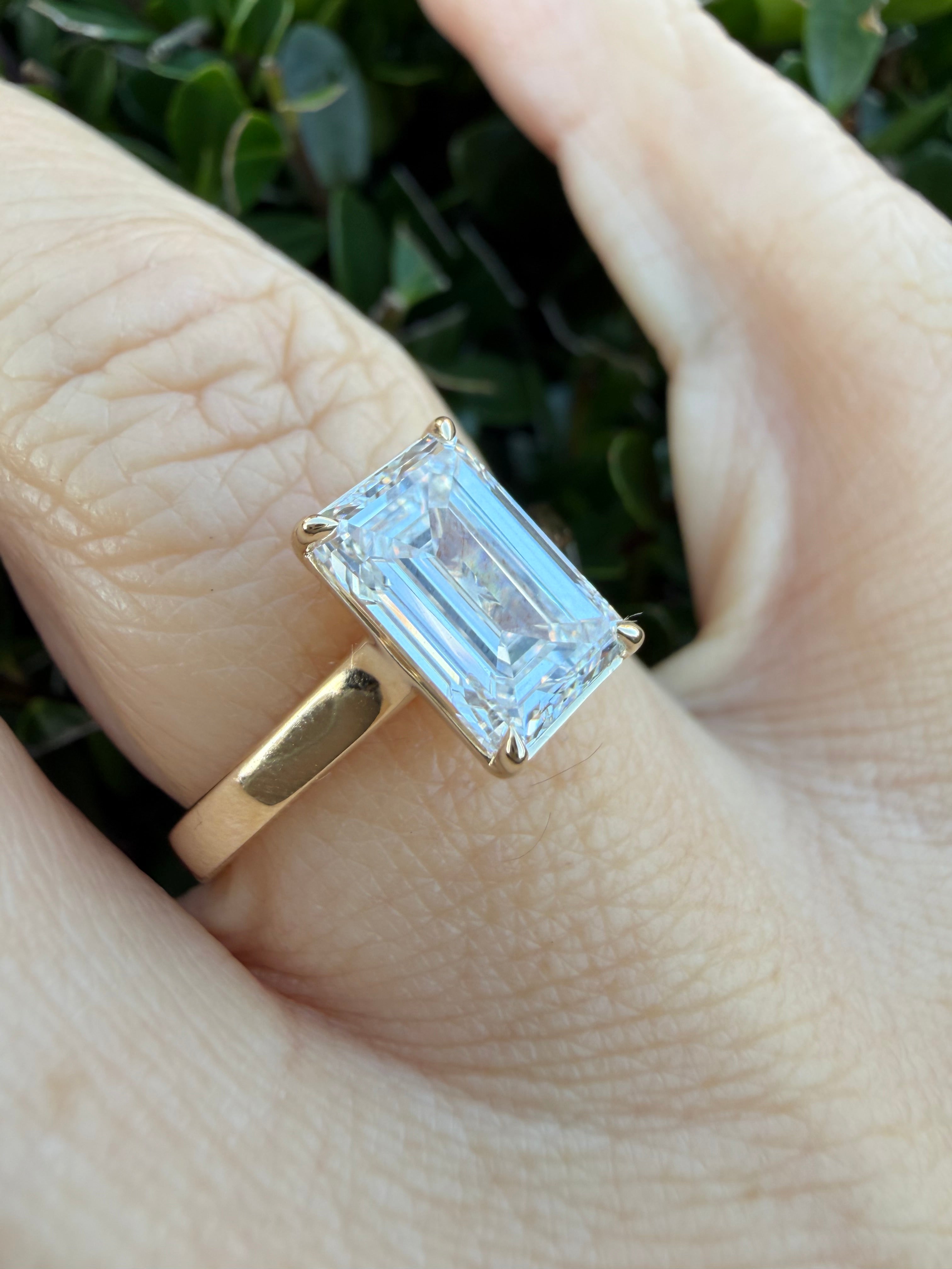 3.01ct emerald cut Lab Grown Diamond Solitaire Ring IGI Certified set in 9k yellow gold