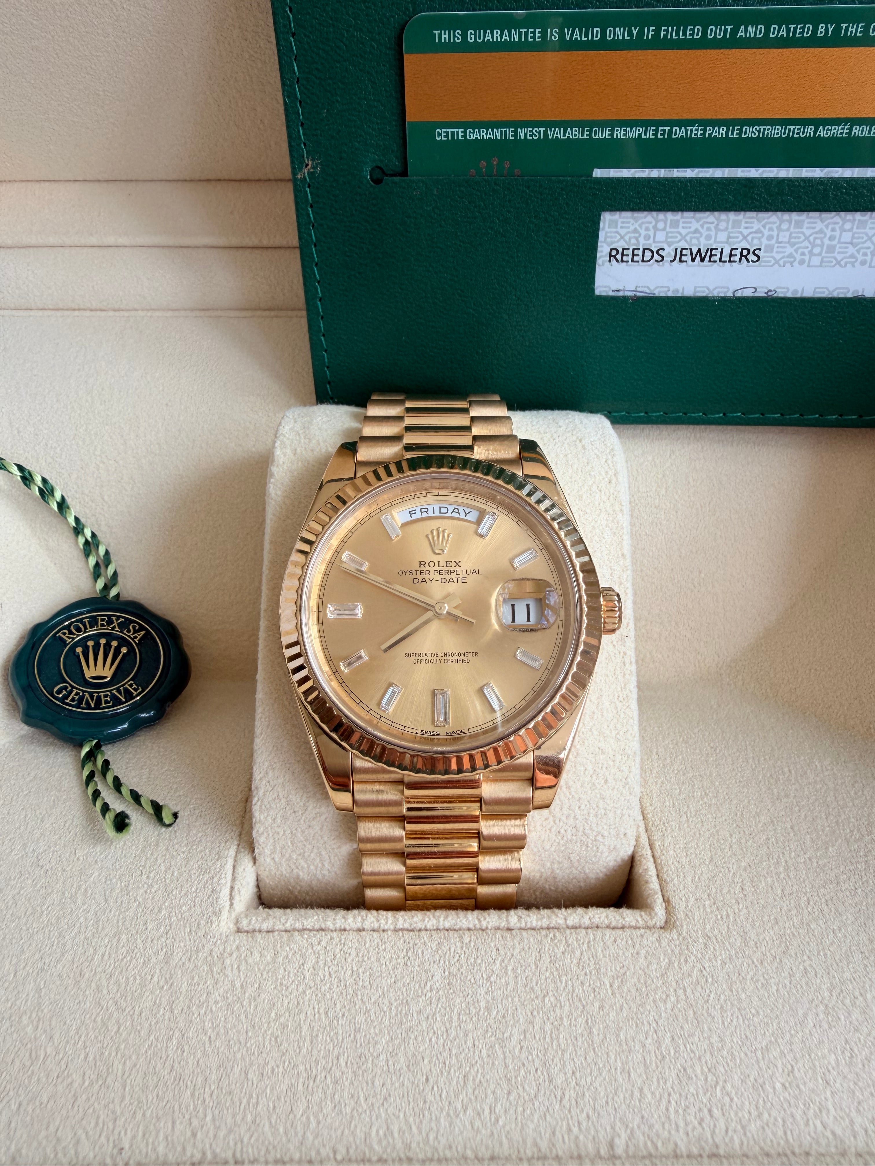 Rolex day date 18k yellow gold 228238 complete with B & P factory champagne baguette diamond dial 2020