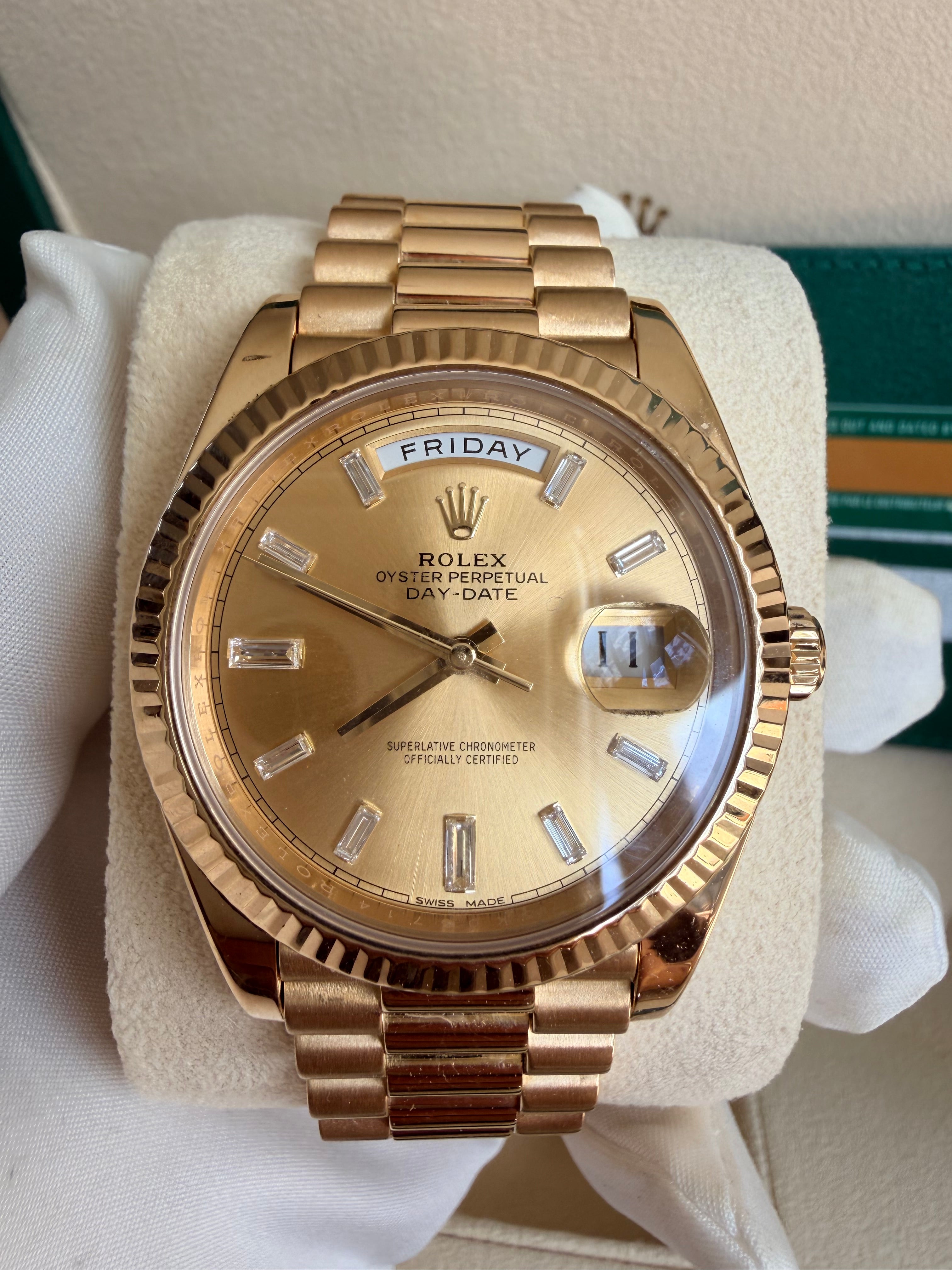 Rolex day date 18k yellow gold 228238 complete with B & P factory champagne baguette diamond dial 2020