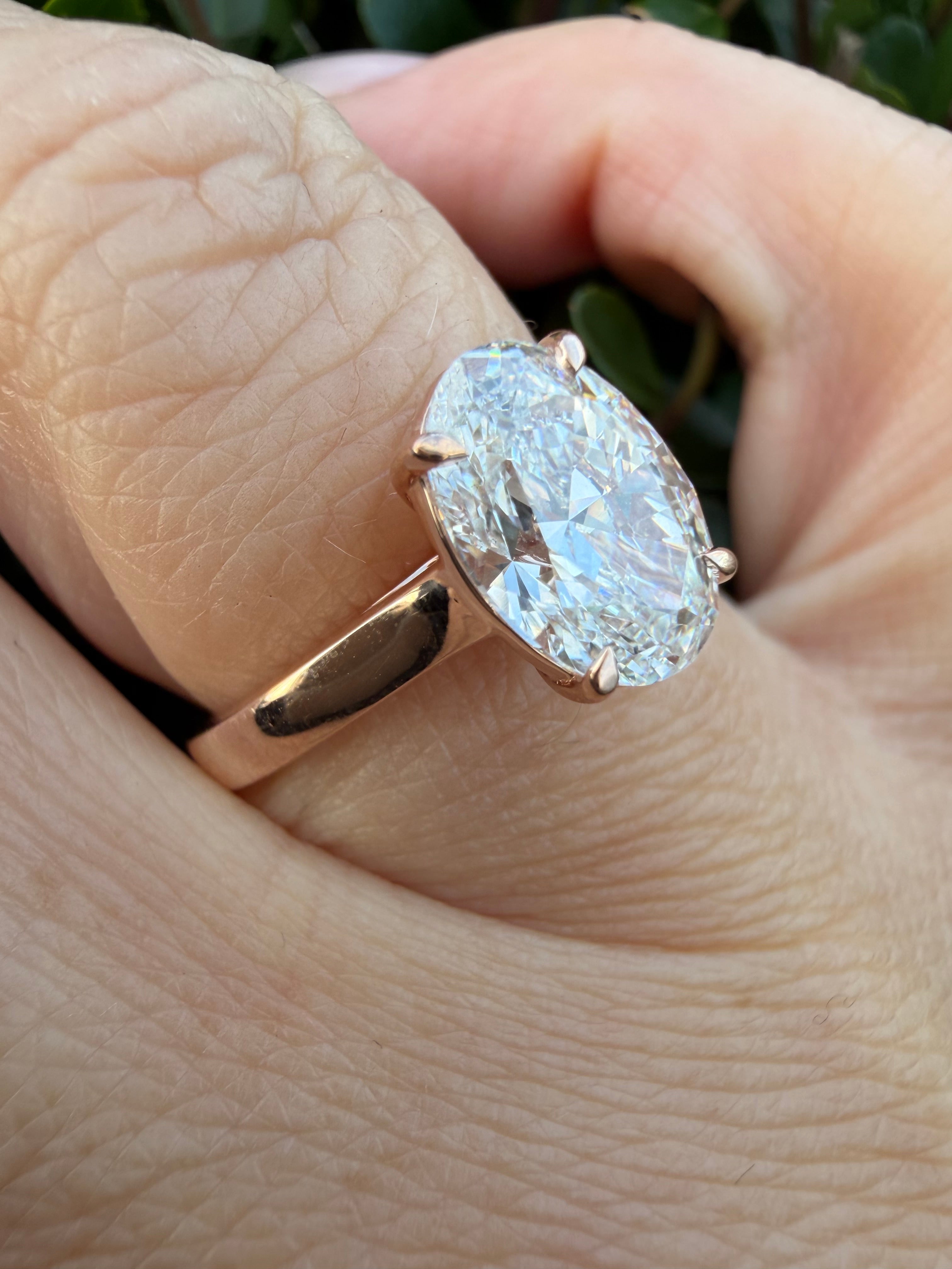 2.01ct oval cut Lab Grown Diamond Solitaire Ring IGI Certified set in 9k rose gold