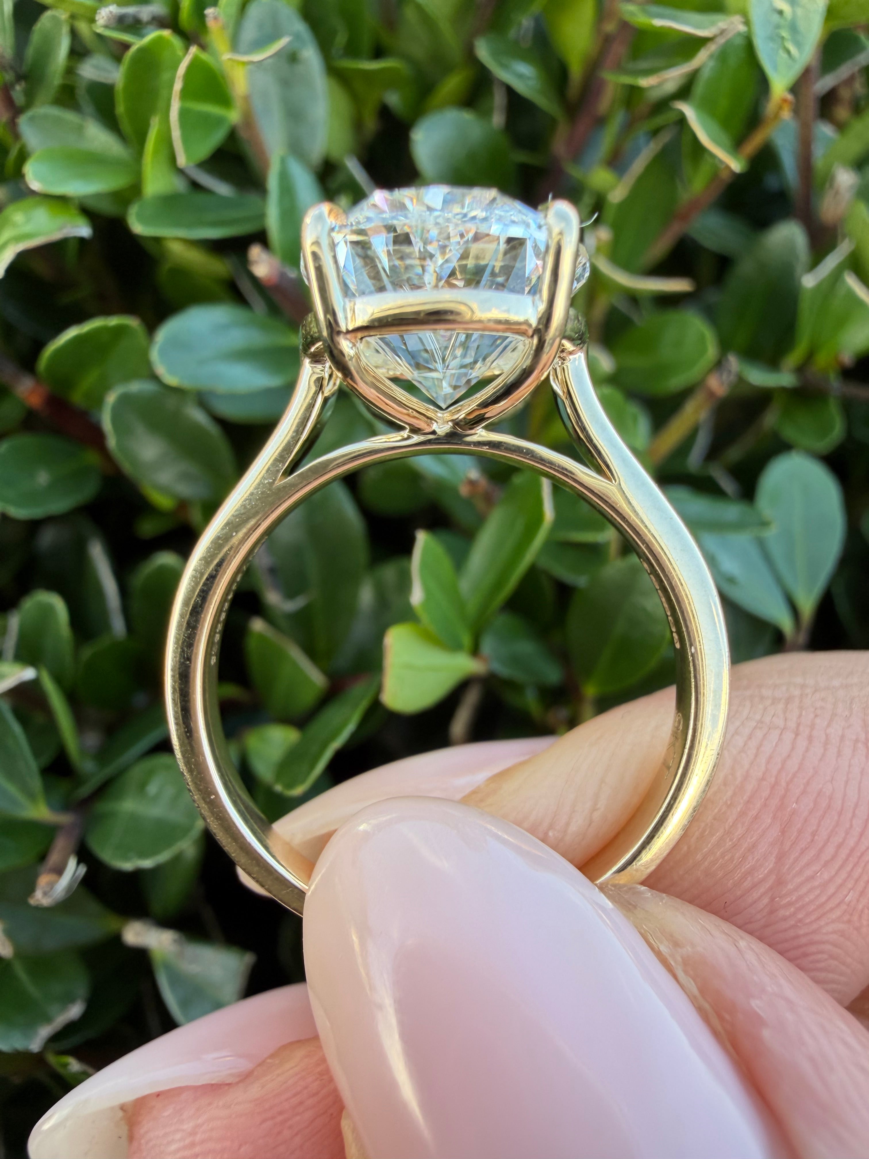 5.01ct Oval brilliant cut Lab Grown Diamond Solitaire Ring IGI Certified set in 9k yellow gold