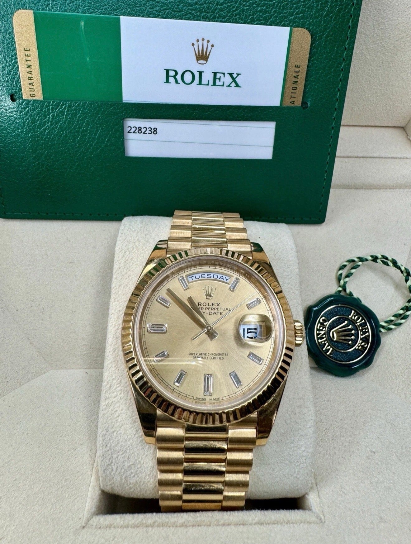 Rolex day date 18k yellow gold 228238 complete with B & P factory champagne baguette diamond dial 2020