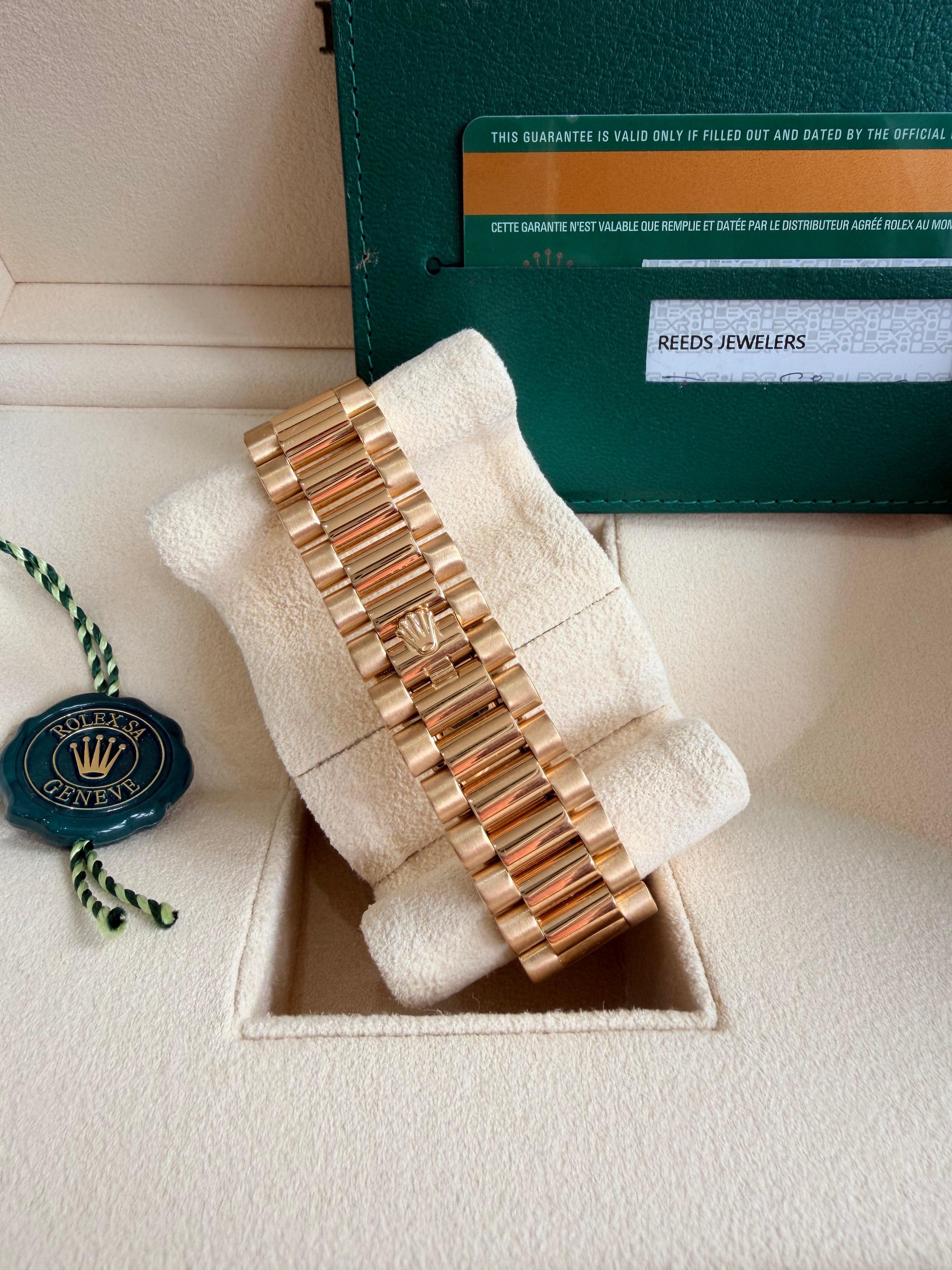 Rolex day date 18k yellow gold 228238 complete with B & P factory champagne baguette diamond dial 2020