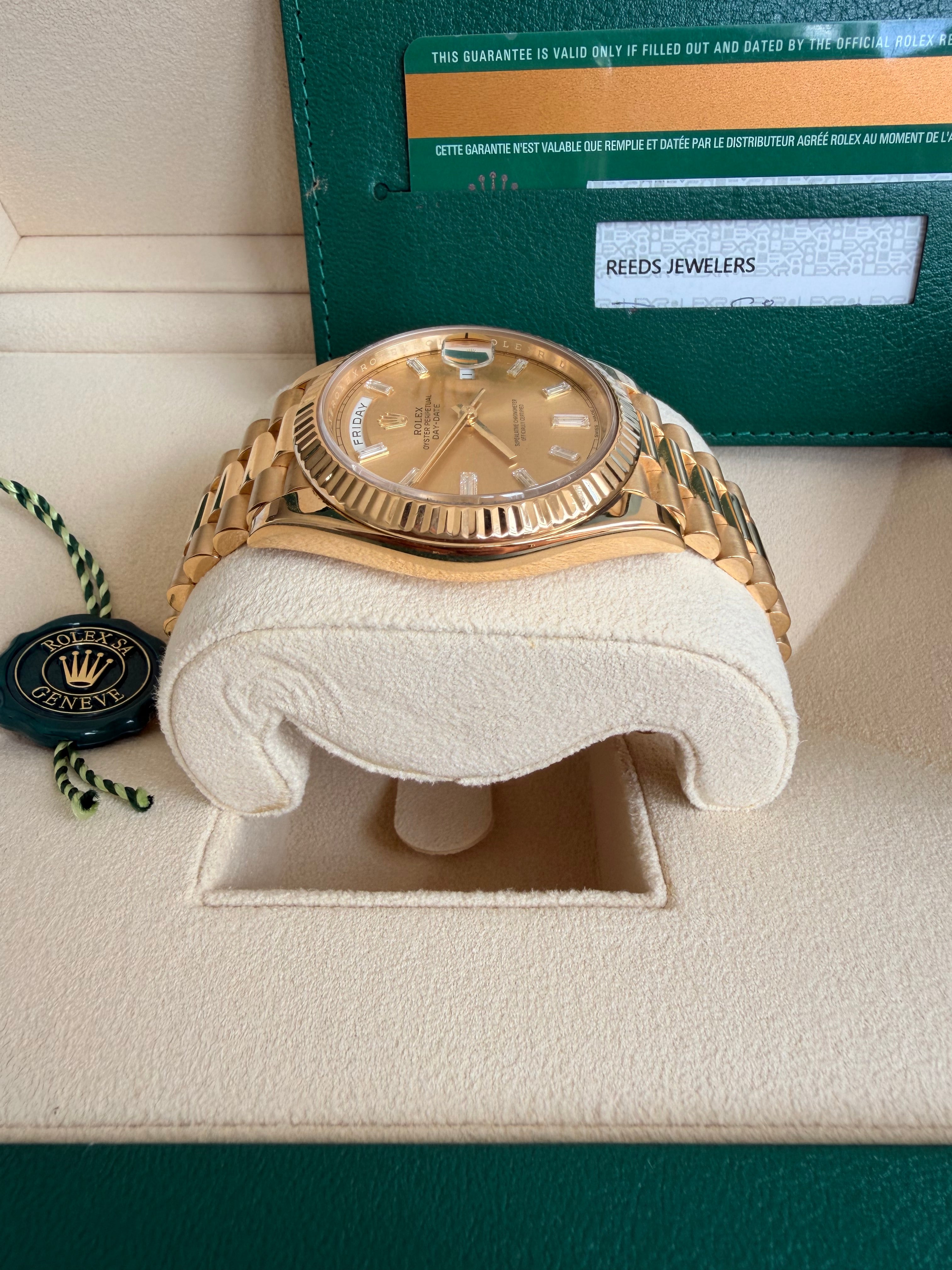 Rolex day date 18k yellow gold 228238 complete with B & P factory champagne baguette diamond dial 2020