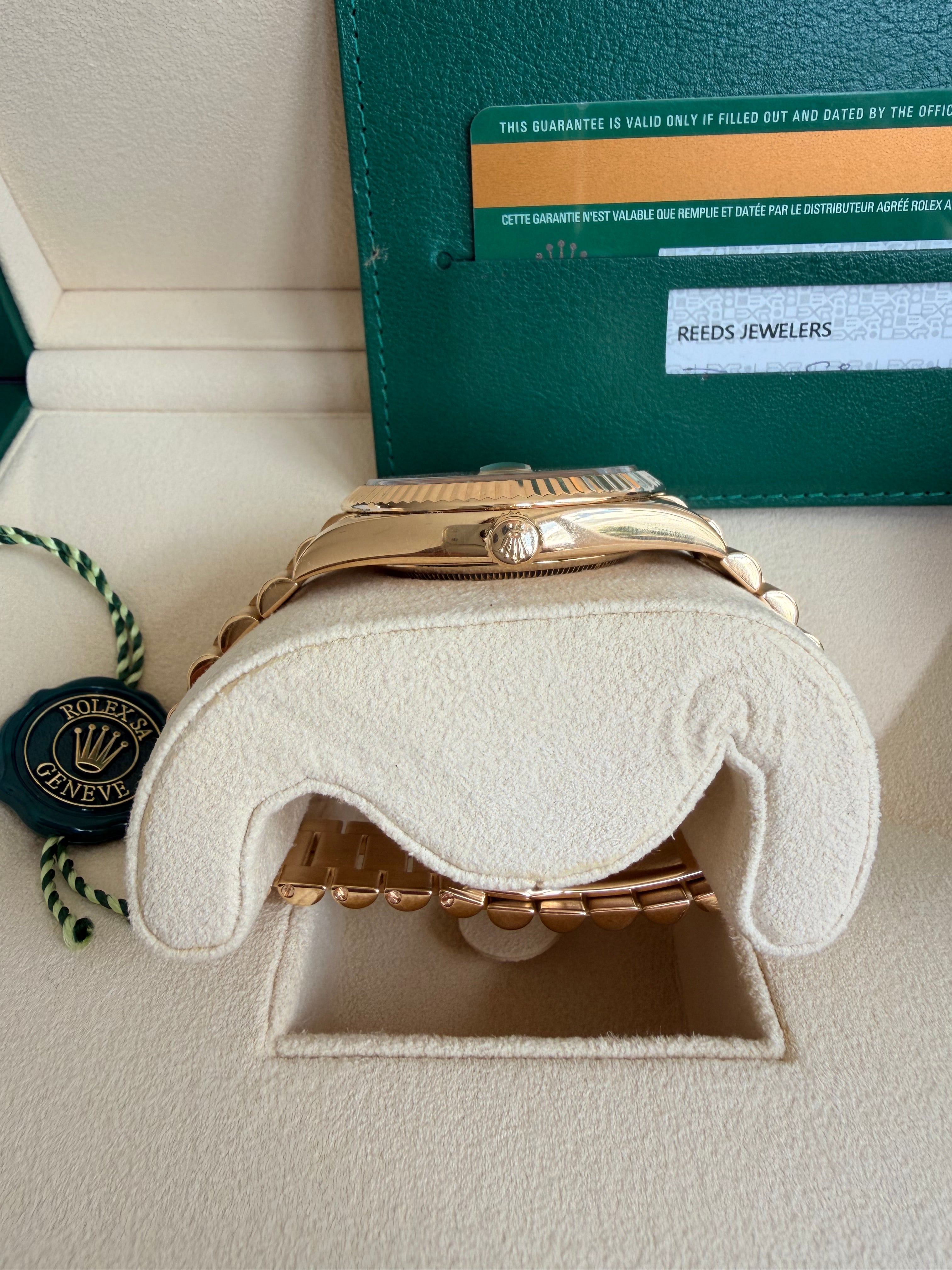Rolex day date 18k yellow gold 228238 complete with B & P factory champagne baguette diamond dial 2020