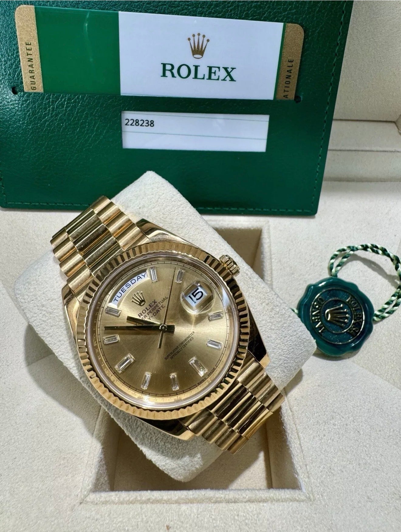 Rolex day date 18k yellow gold 228238 complete with B & P factory champagne baguette diamond dial 2020